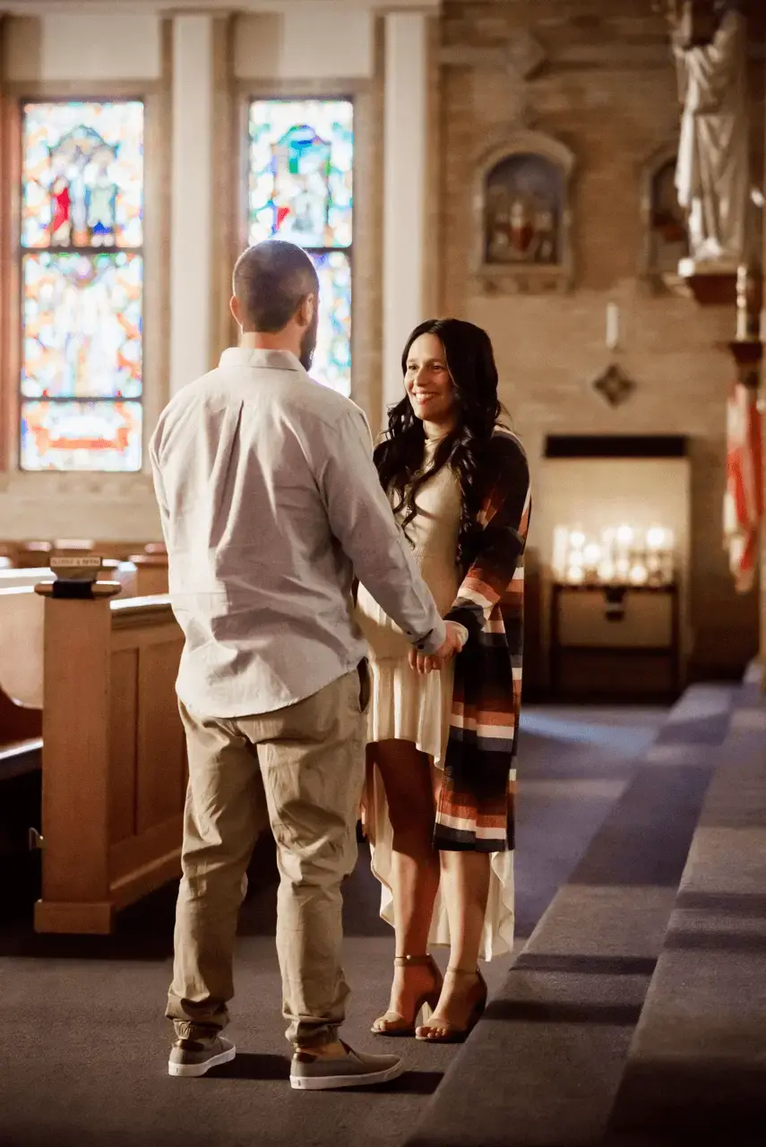 Witness to Love civilly married couple holding hands inside of a church